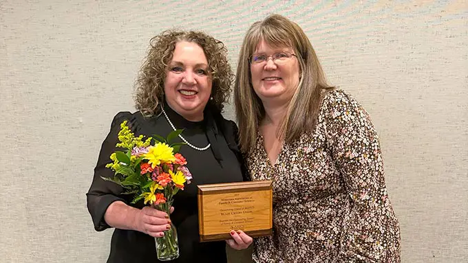 photo of Tina Jones receiving MAFCS Outstanding Friend Award